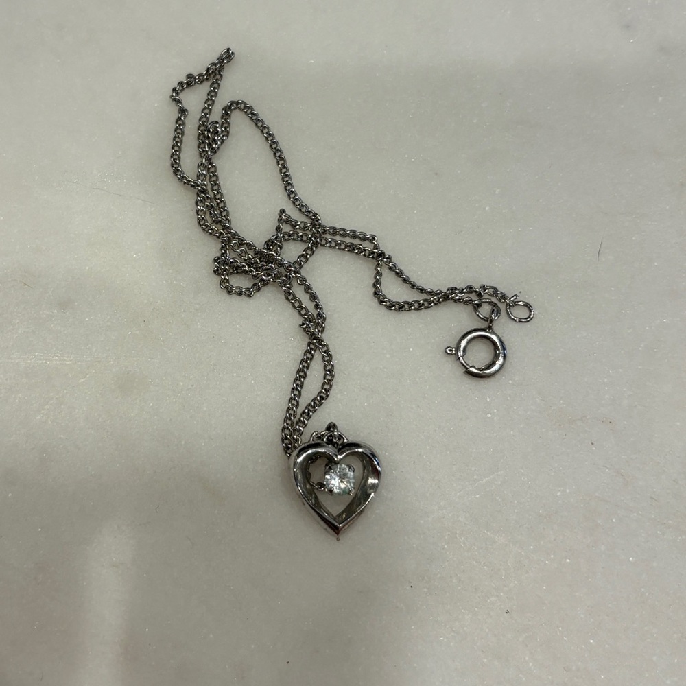 Silver-colored heart necklace; FREE if bundled with any other item.